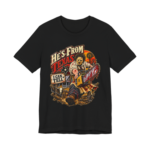 Leatherface revving a bloody chainsaw under He's From Texas, I Can Tell, on a t-shirt — Black