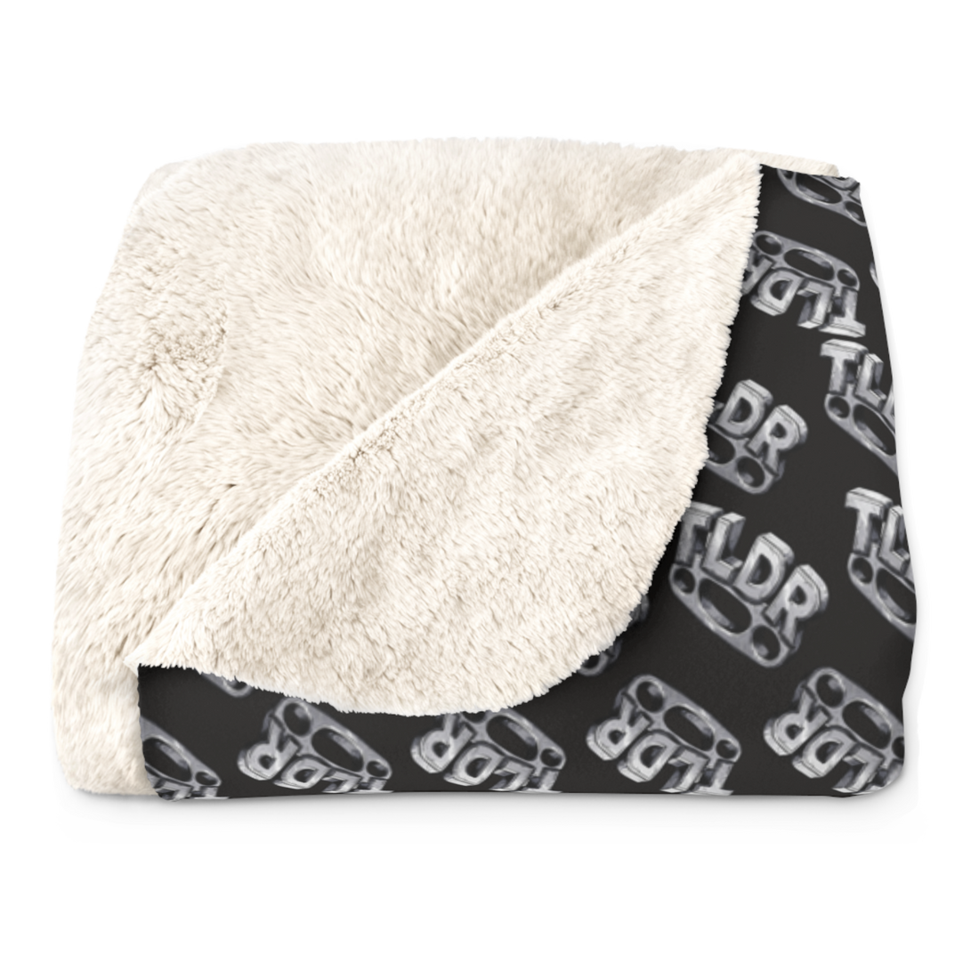 Brass knuckles whose four striking points spell TLDR, on a blanket
