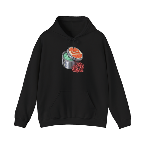 Garage wax tin of green toothpaste labeled EXPOSED BONE POLISH with a shop rag, on a hoodie — Black