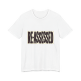 RE-ASSESSED Stamp T-Shirt — Funny Dystopian Bureaucracy Tee
