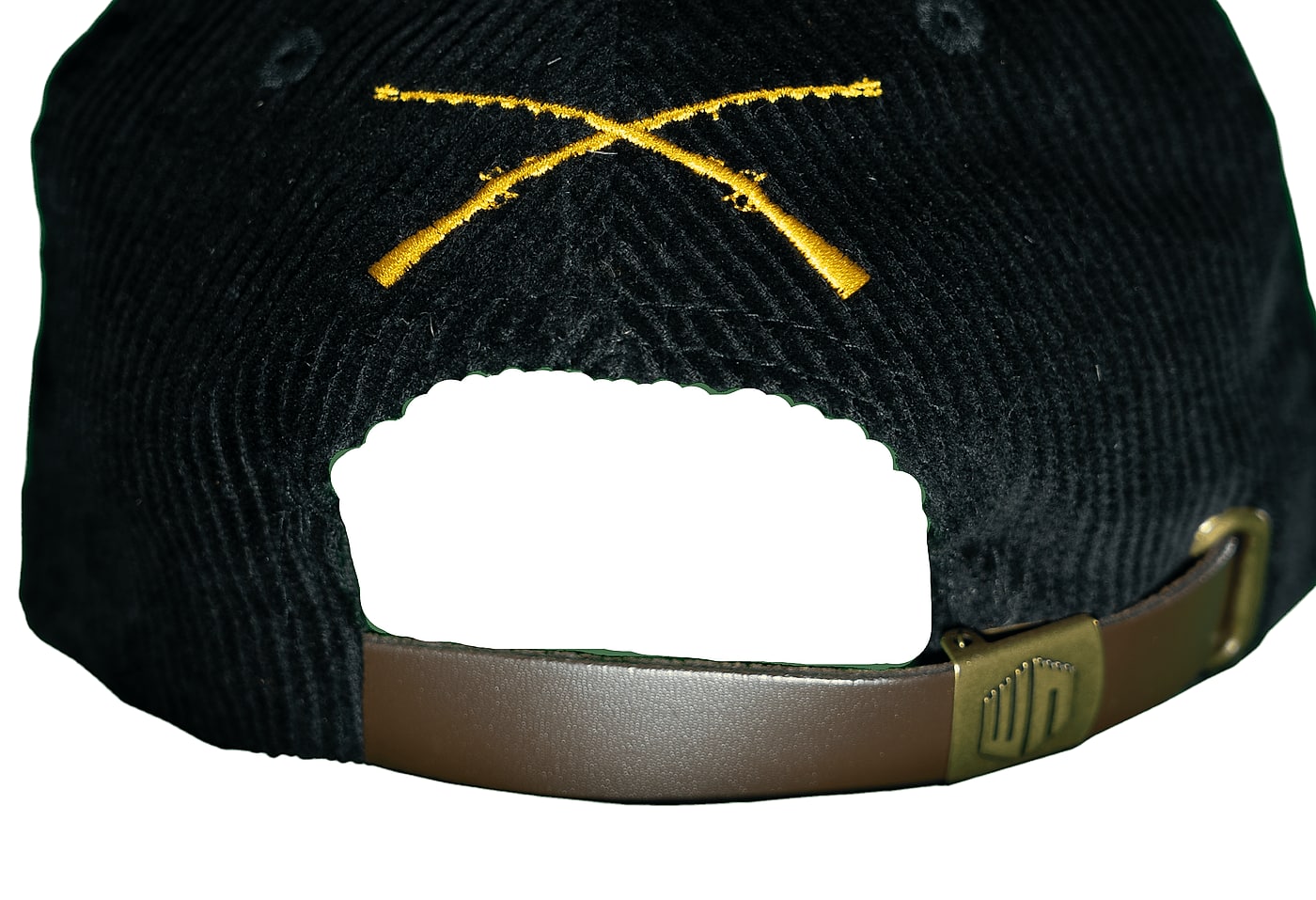 Rear view: crossed infantry rifles embroidered above a brown leather strap with antique brass hardware