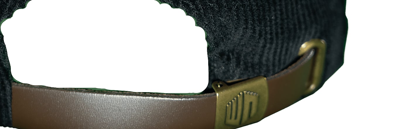 Macro of the brass strap keeper, stamped with the castle sigil