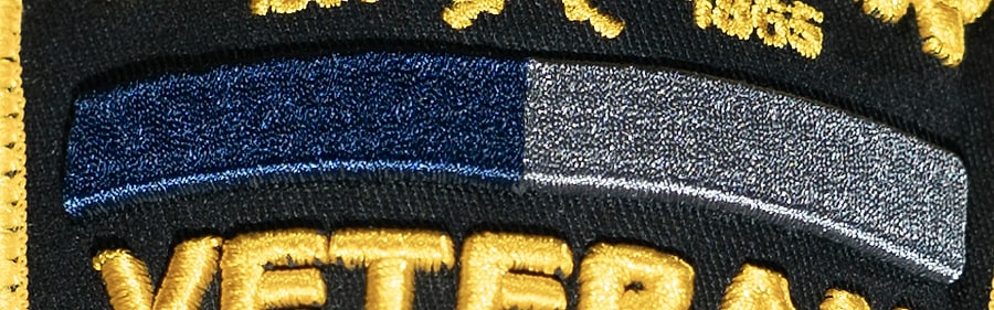 Macro of the service ribbon: one bar, Union navy on the left, Confederate gray on the right